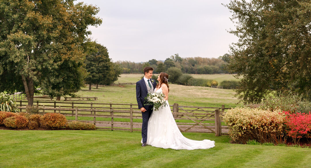 Mythe Barn bride and groom countryside